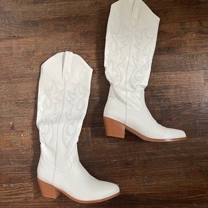 Below the knee white cowboy boots